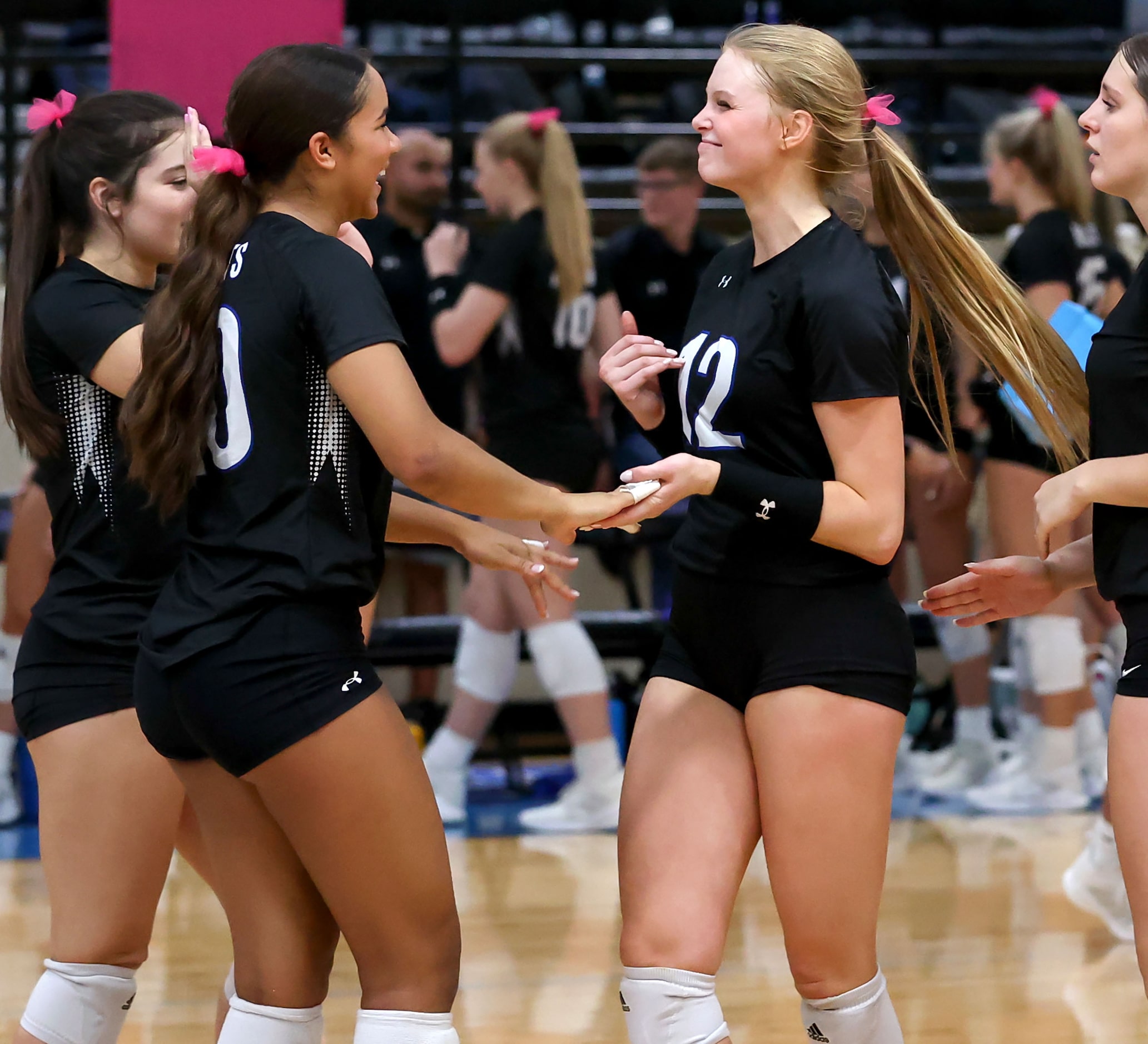 Byron Nelson's Sophee Peterson (left) and Ashlyn Seay (12) celebrate a point against Keller...