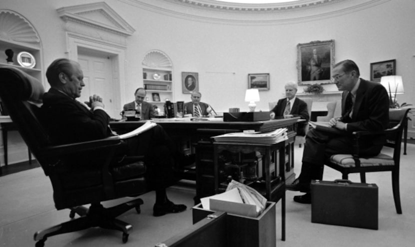 William Colby, right, director of the CIA, meets with President Gerald Ford  on a report...