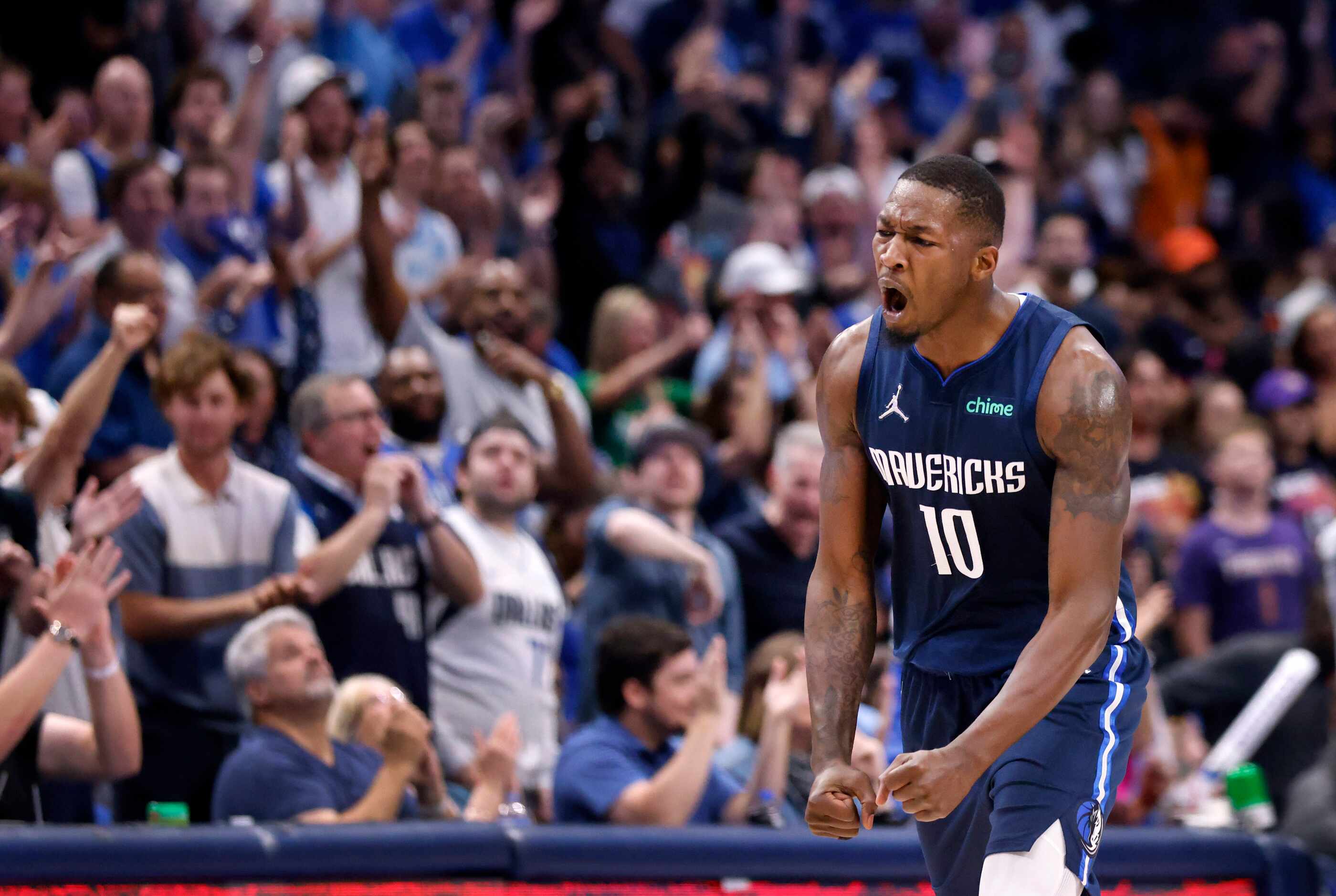 Dallas Mavericks forward Dorian Finney-Smith (10) reacts after hitting a first quarter...