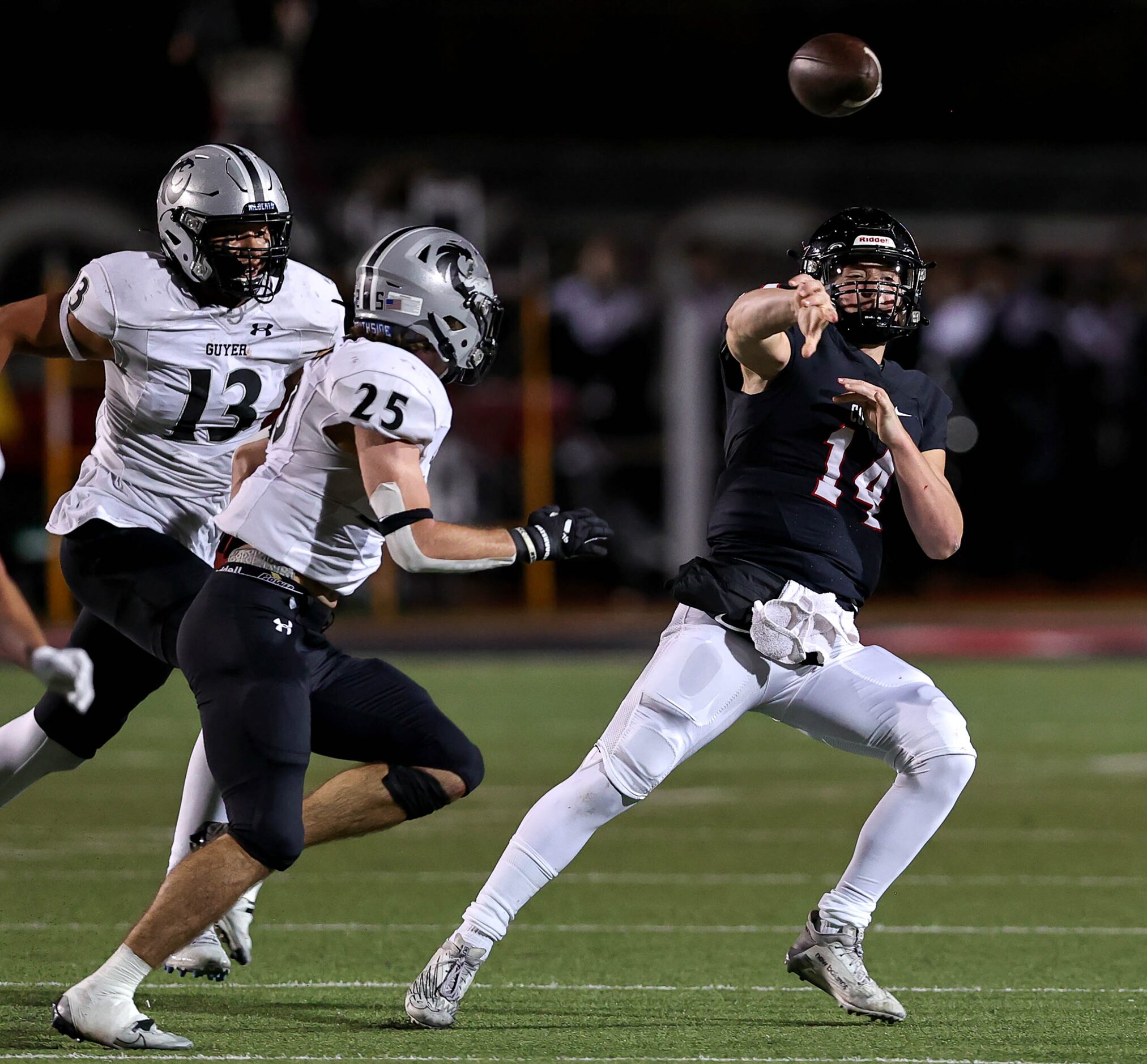 Coppell quarterback Edward Griffin (14) gets pressured by Denton Guyer linebacker Caden...