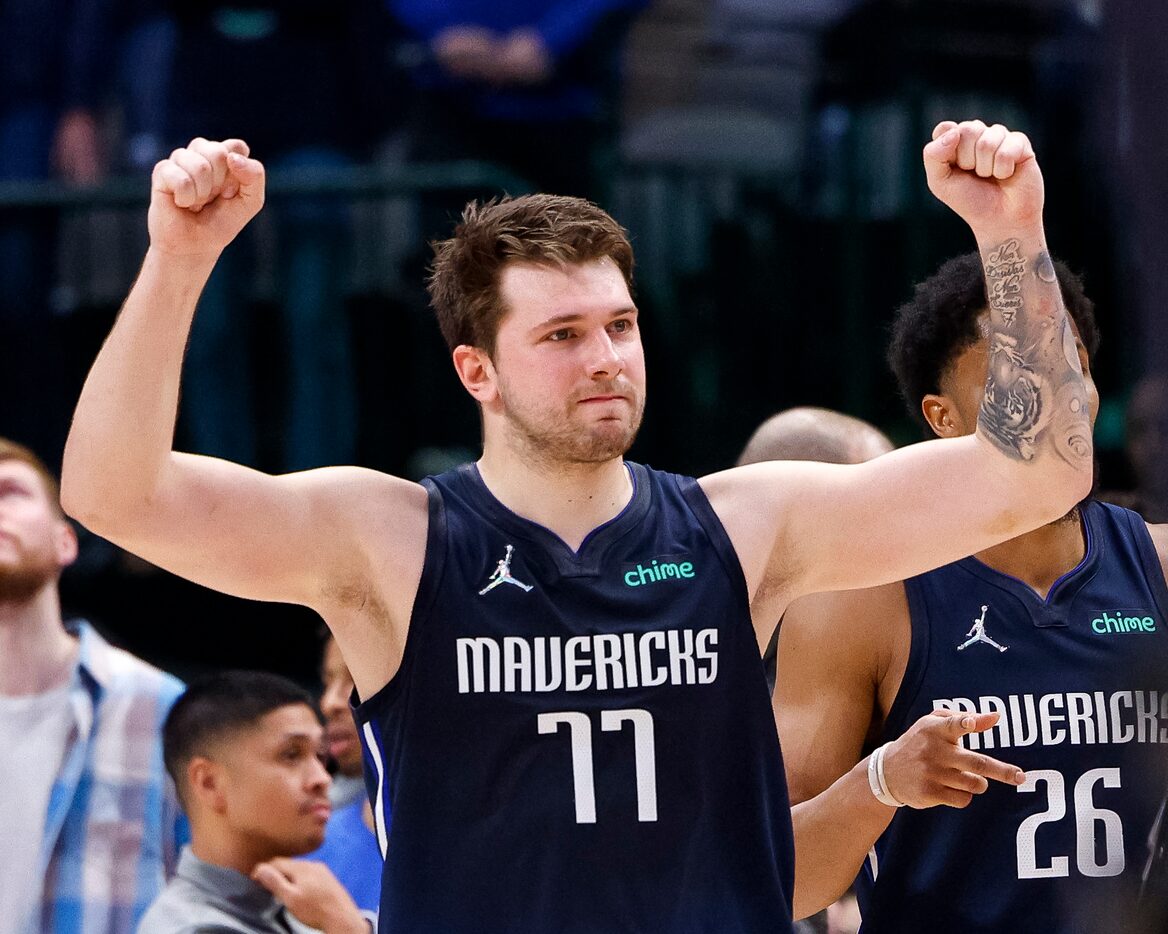 Dallas Mavericks guard Luka Doncic (77) reacts after a foul called against him is overturned...