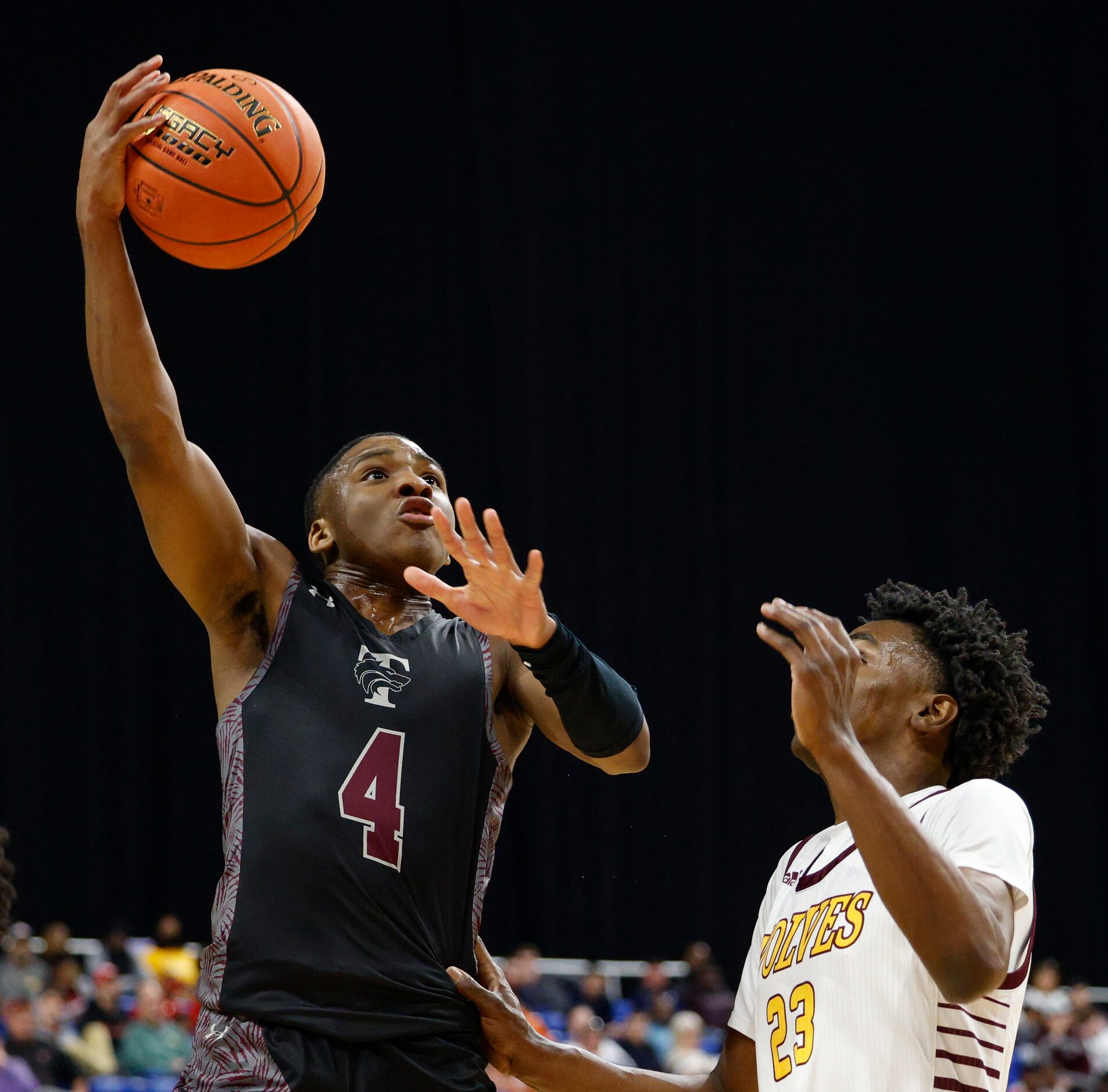 Mansfield Timberview guard Donovan O'Day (4) attempts a layup over Beaumont United forward...