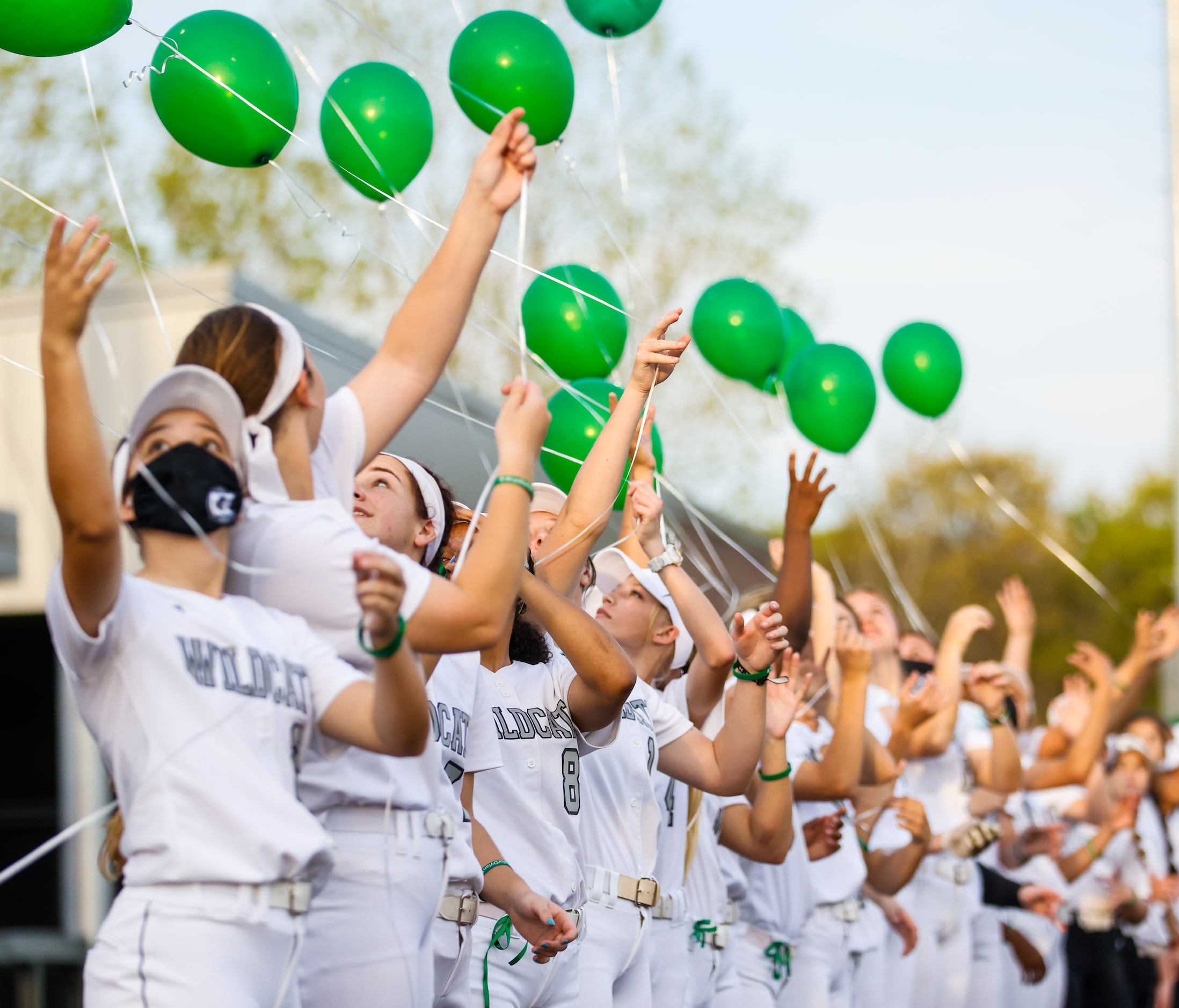 Denton Guyer players release balloons in honor of Dylan Dorrell before a game against Keller...