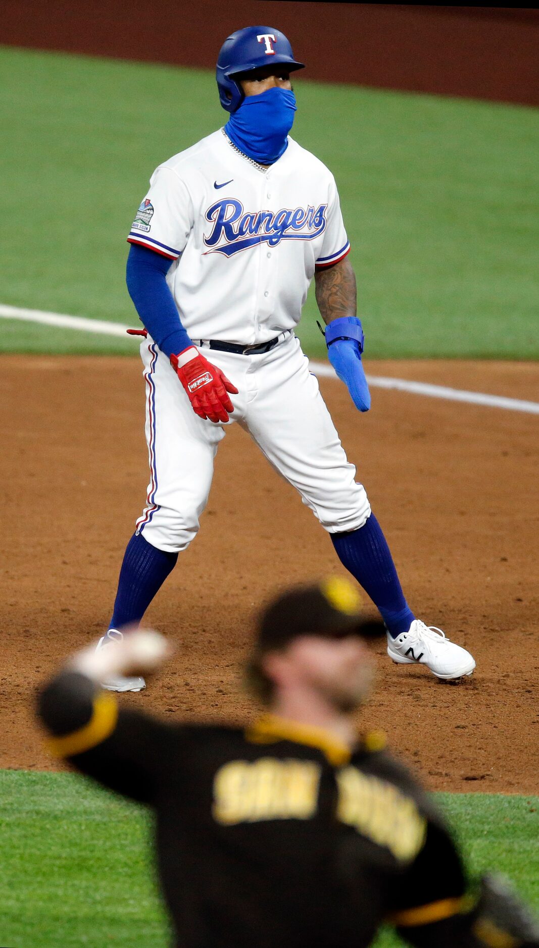 Texas Rangers designated hitter Danny Santana (38) takes a lead off of first base against...