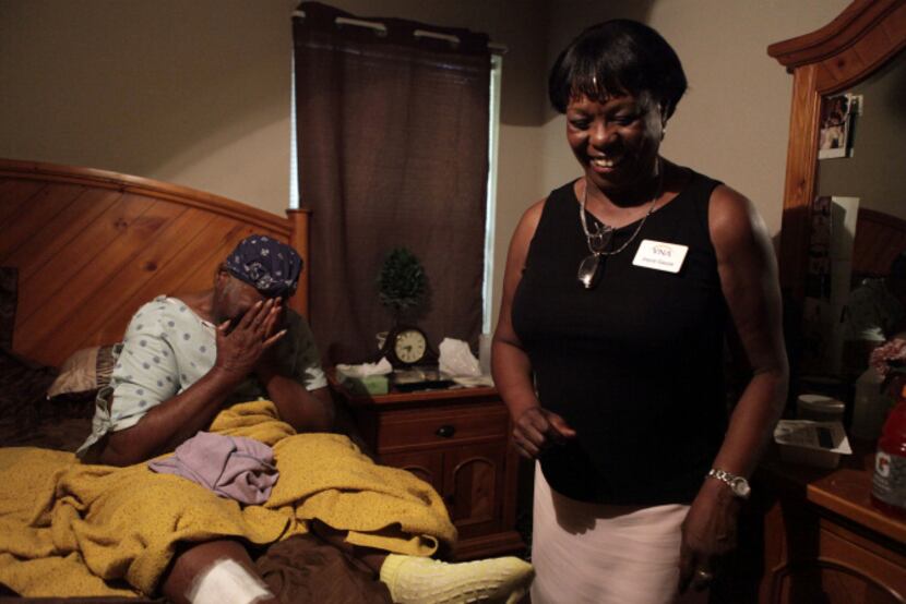 Druscilla Waites (left) was emotional as a meal is delivered to her home by Joyce Gause from...