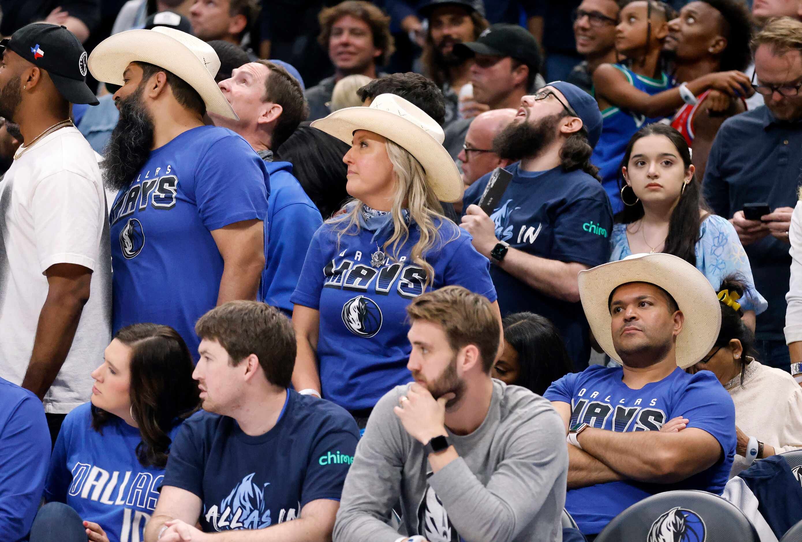 Dallas Mavericks fans react to the Mavs losing effort in the fourth quarter after the game...
