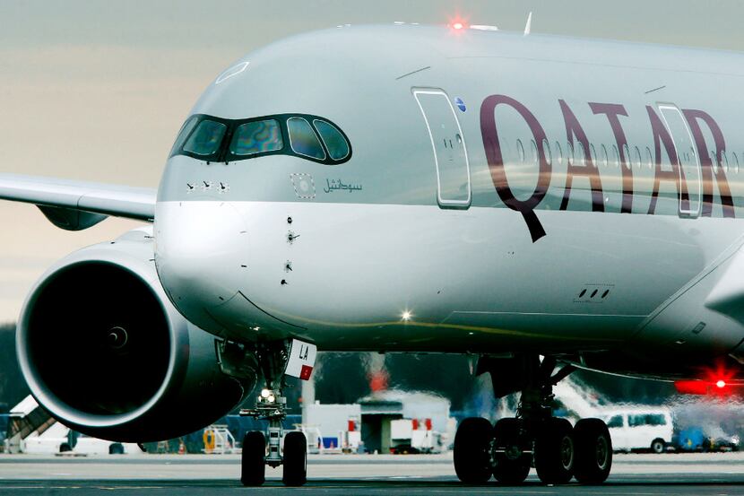 FILE- In this Jan. 15, 2015, file photo, a Qatar Airways jet arriving from Doha, Qatar,...