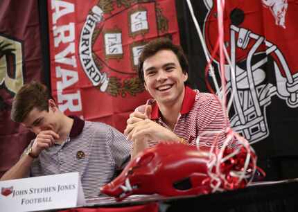 FILE - John Stephen Jones (right), who would sign to play football at the University of...