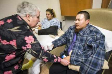  Jose Santillano, right, and his wife Zuleyma, center, wereÂ comforted by chaplain Raylene...