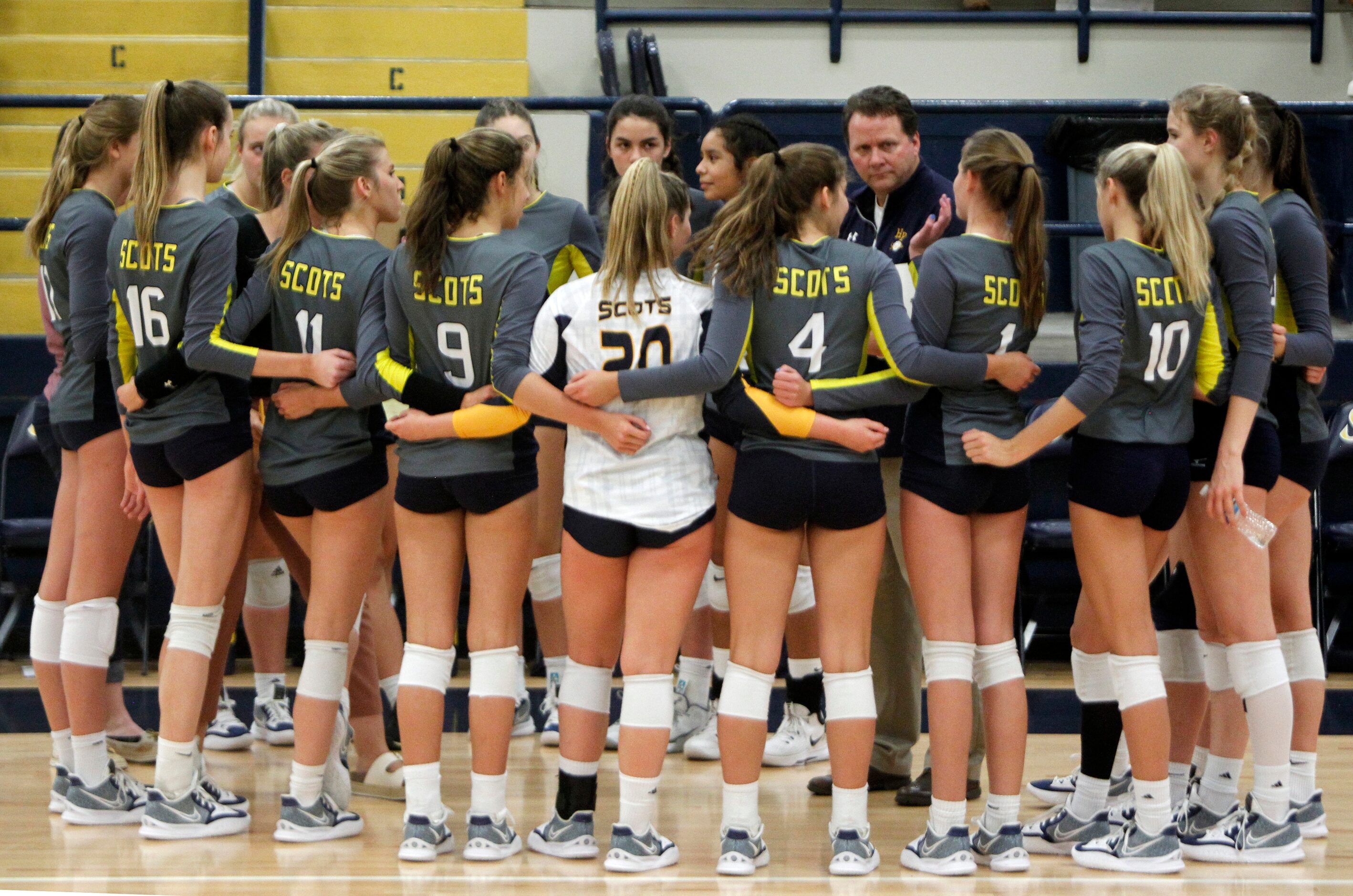 Highland Park head coach Michael Dearman listens to player feedback during a timeout in the...