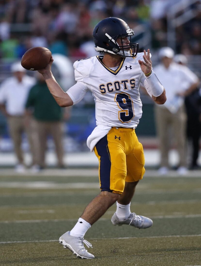 Highland Park quarterback John Stephen Jones (9) looks to make a pass during the first...