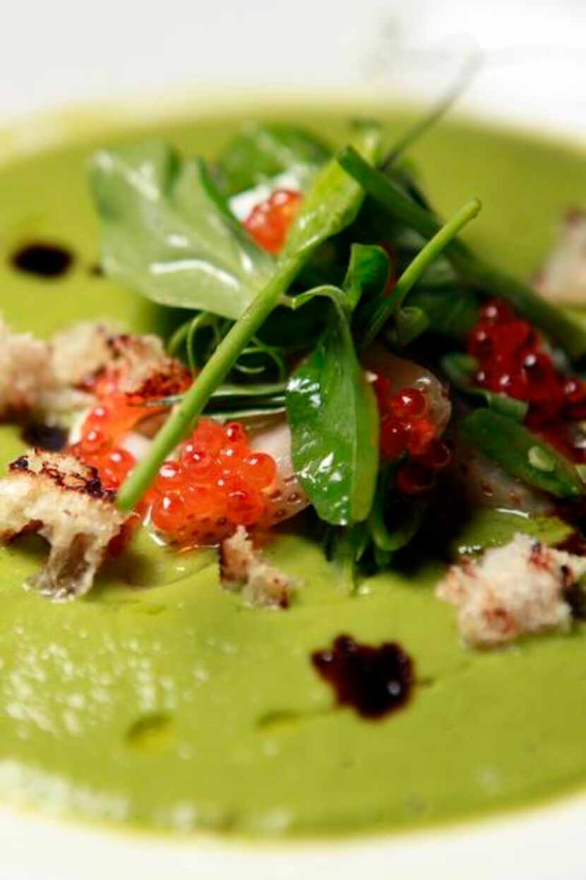 
Brewer’s English pea gazpacho is garnished with pea leaves, creme fraiche, sugar snaps,...
