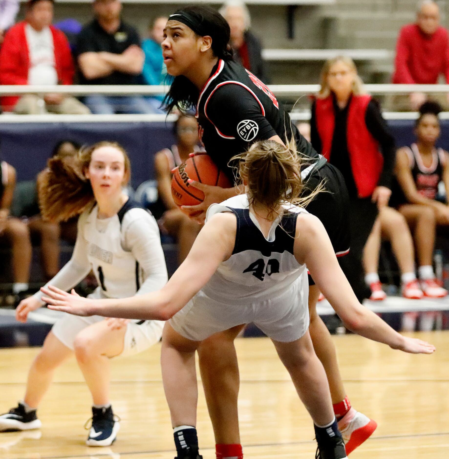 Irving MacArthur High School post Hannah Gusters (21) was called for the offensive foul on...