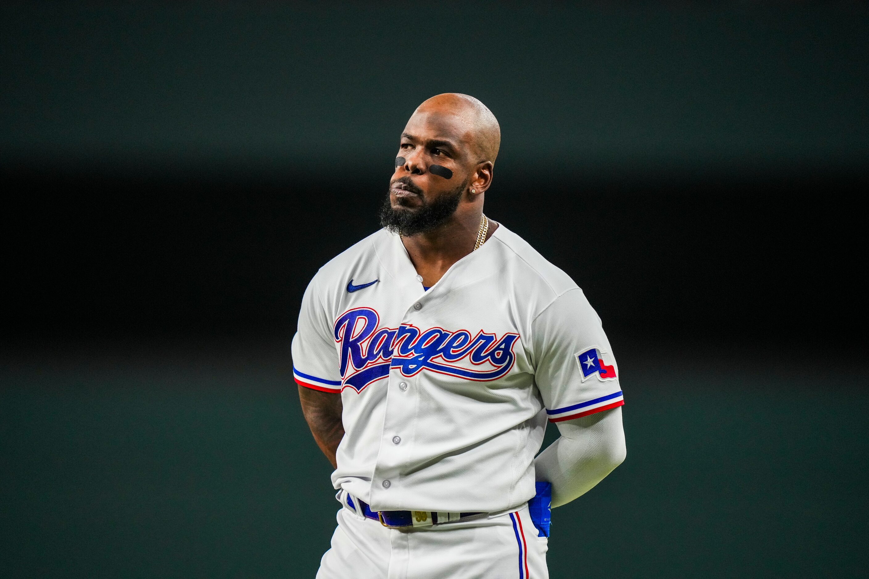 Texas Rangers right fielder Adolis Garcia looks on from first base after an altercation...