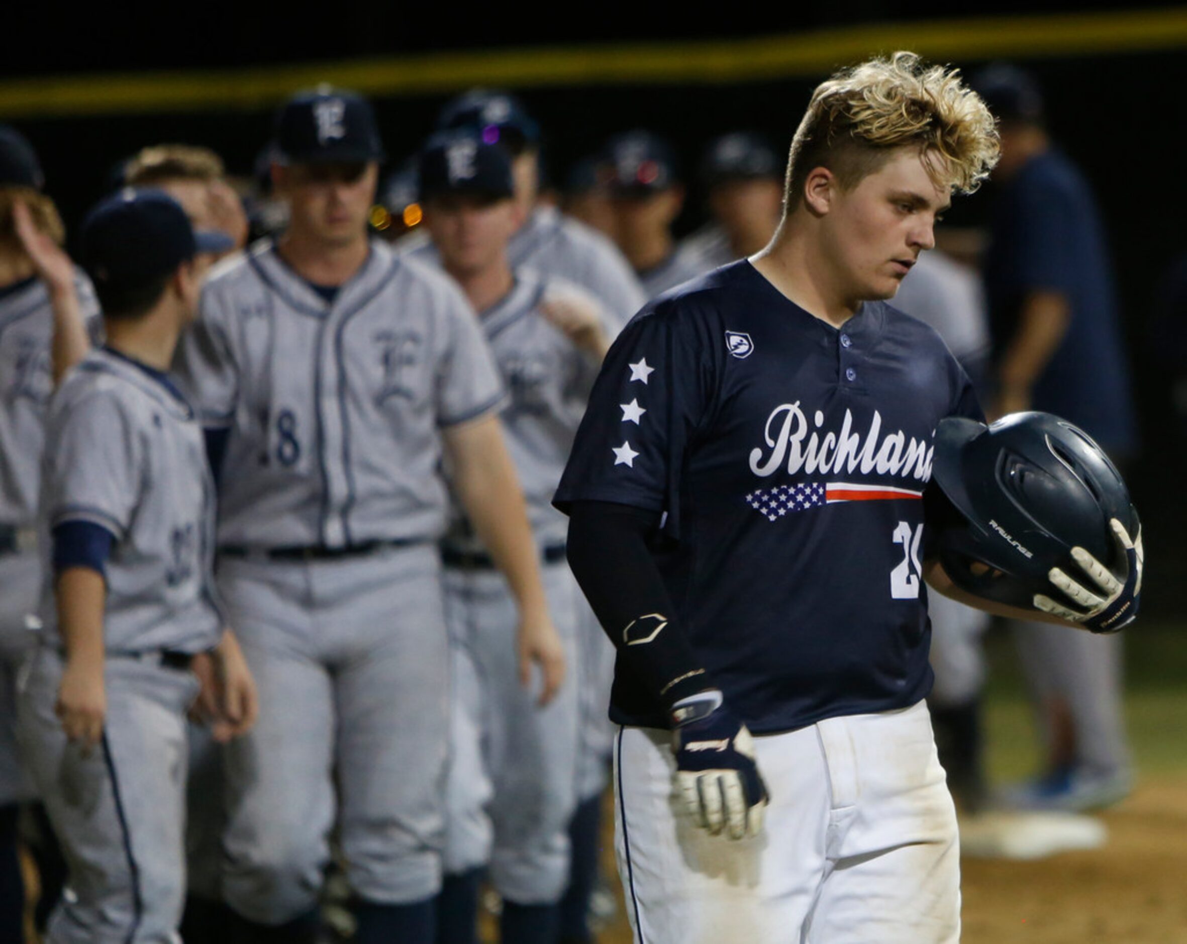 Richland catcher Matt Makarwich (21) leaves the field after a season ending loss to...