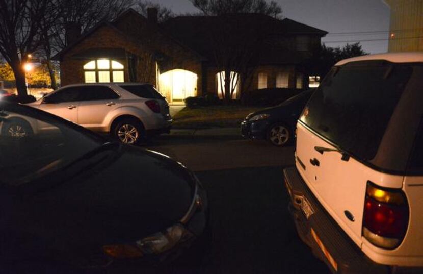 
Cars line the street outside the residence on Mumford Court where Congregation Toras Chaim...