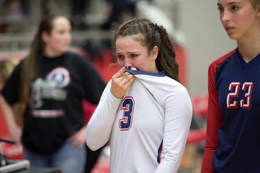 Allen libero Shelby Perlich fights back tears as she leaves the court after losing to...