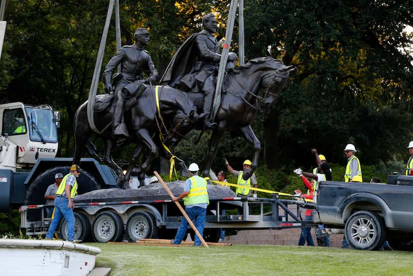 Workers removed the Robert E. Lee statue on Sept. 14, 2017. (Nathan Hunsinger/Staff...