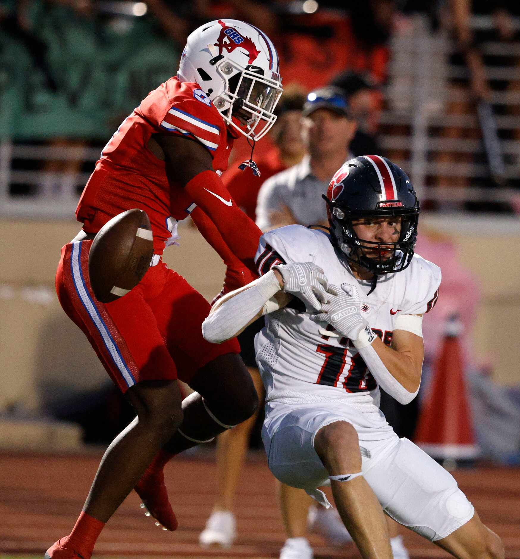 Colleyville Heritage's Kai Pruitt (10) fails to make the catch against Grapevine's Dereon...