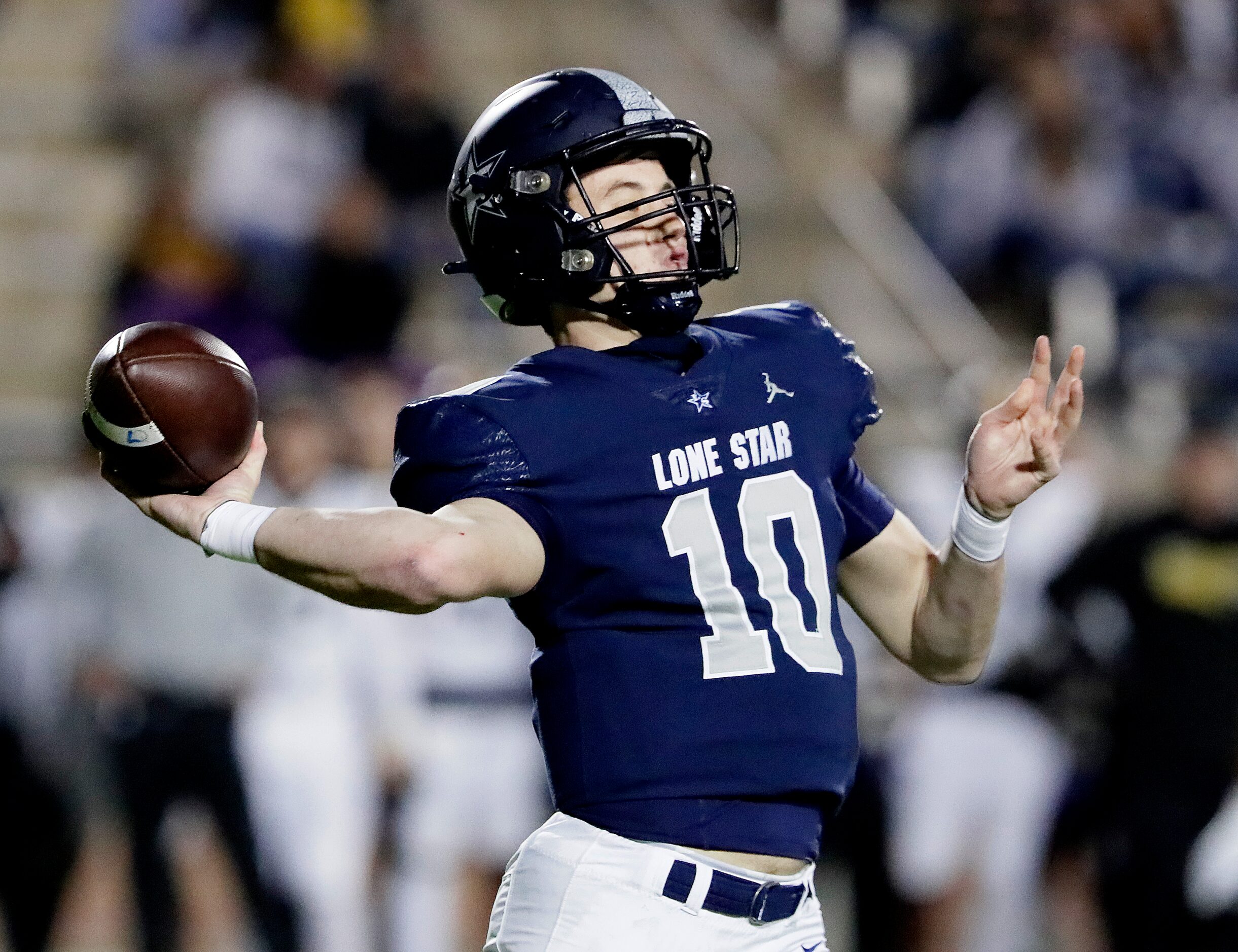 Lone Star High School quarterback Collin Blackstock (10) throws a pass during the first half...