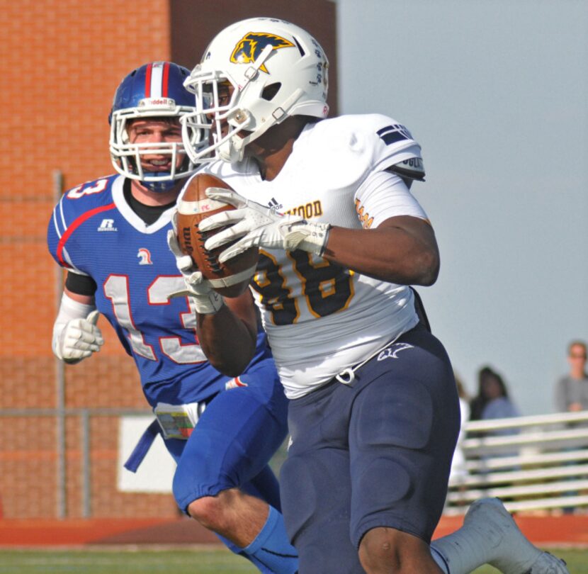 Prestonwood sophomore Michael Irvin (88) sprints across the goal line as TCA - Addison's...