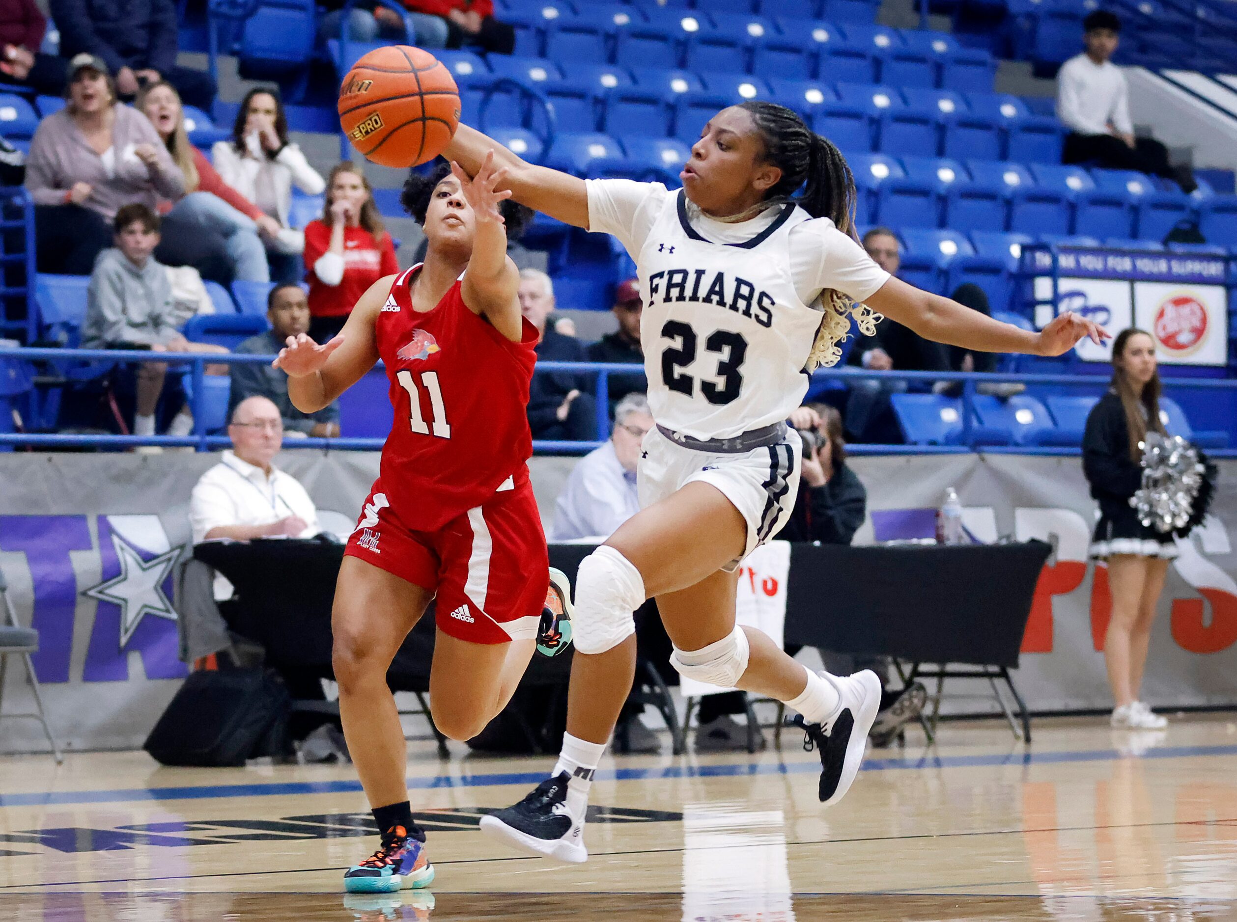 Bishop Lynch guard Mikah Ford (23) steals a long pass to John Paul II guard Lydia...