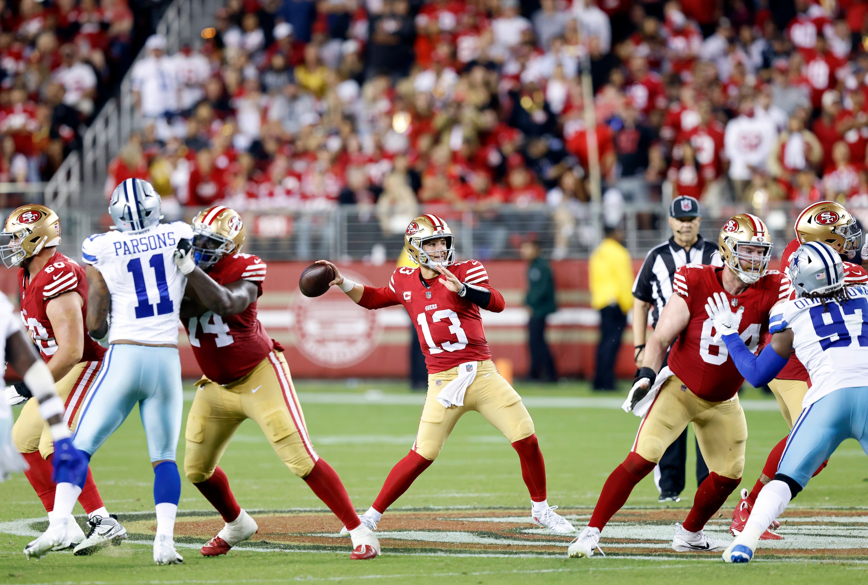 San Francisco 49ers quarterback Brock Purdy (13) throws a deep pass against the Dallas...