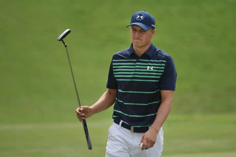 CHARLOTTE, NC - AUGUST 13:  Jordan Spieth of the United States reacts to his putt on the...