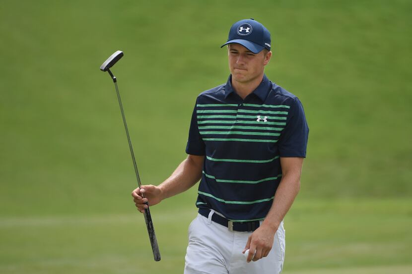 CHARLOTTE, NC - AUGUST 13:  Jordan Spieth of the United States reacts to his putt on the...