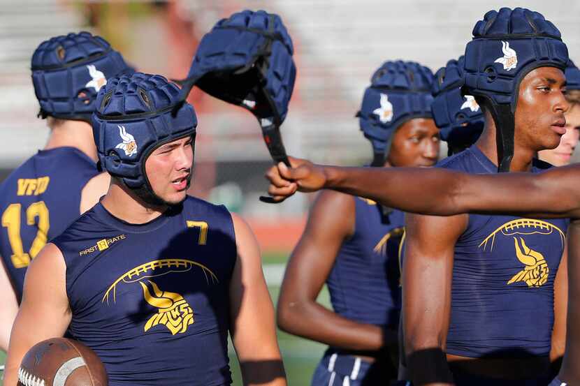 Jack Dawson, left, is pictured with teammates as the Arlington Lamar High School 7-on-7...