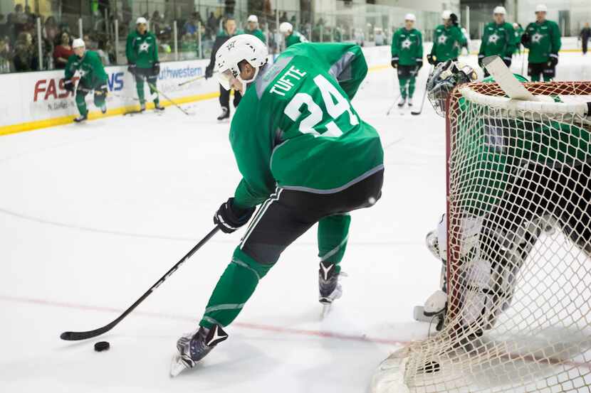 Forward Riley Tufte (24) works against goalie Landon Bow on the first day of Dallas Stars...