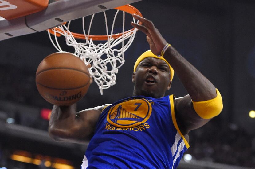 Golden State Warriors center Jermaine O'Neal dunks during the second half in Game 1 of an...
