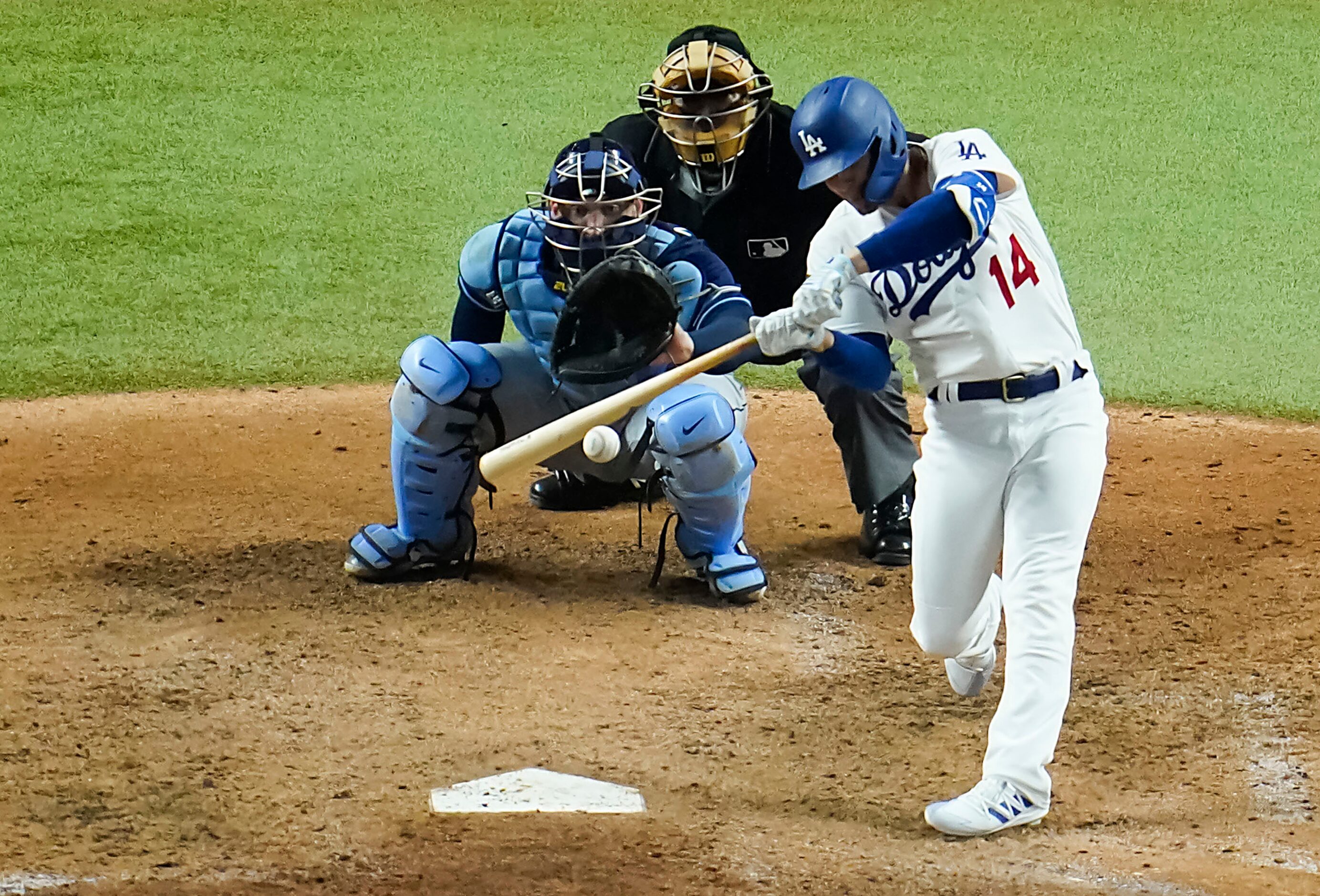 Los Angeles Dodgers pinch hitter Enrique Hernandez drives in a run with a single during the...