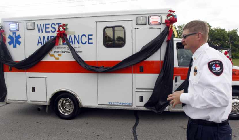 A West ambulance, adorned with black ribbon in memory of victims of last week's deadly...