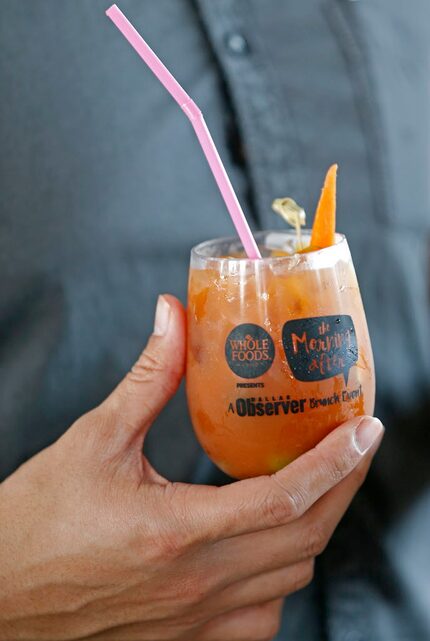 A patron holds a cocktail of Bloody Mary during Morning After Brunch Festival at Dallas...