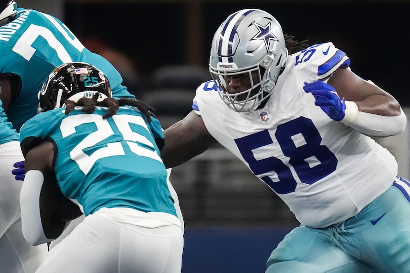 Dallas Cowboys defensive tackle Mazi Smith (58) brings down Jacksonville Jaguars running...