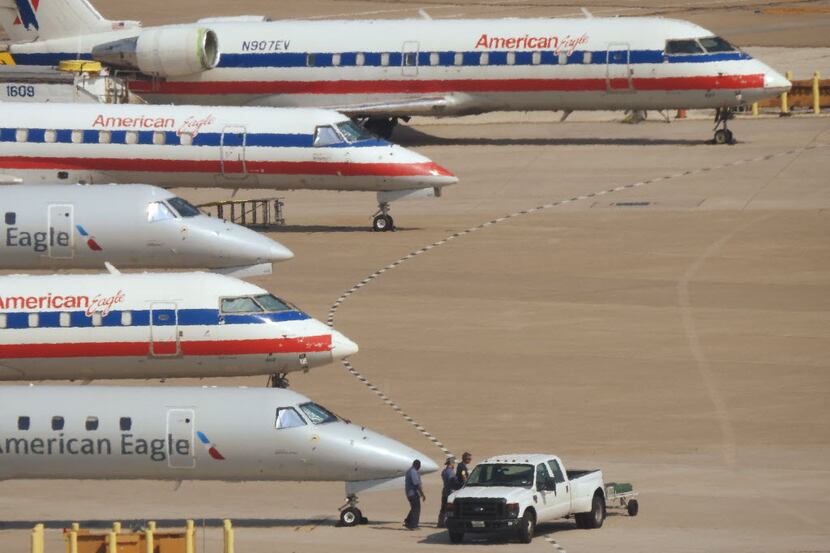 A line of American Eagle airplanes at DFW International Airport in Irving Friday,  July 31,...