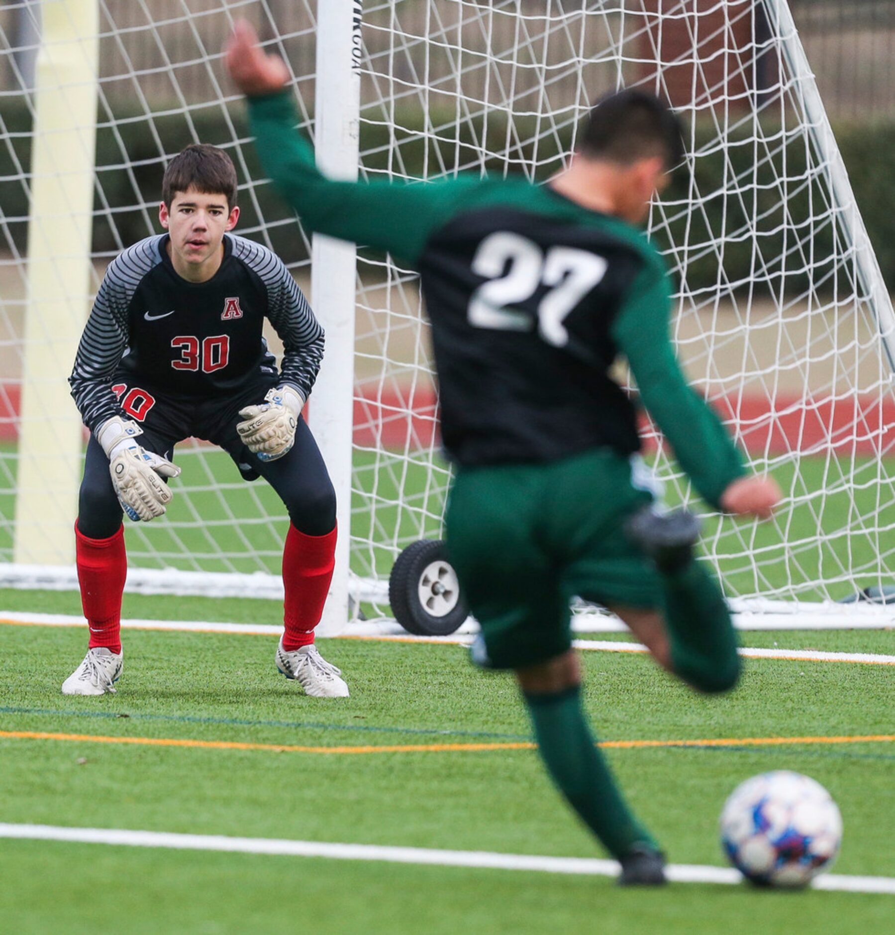 Allen keeper Jackson Leavitt (30) fails to block a shot by Prosper's Gavyn Rosales (27)...