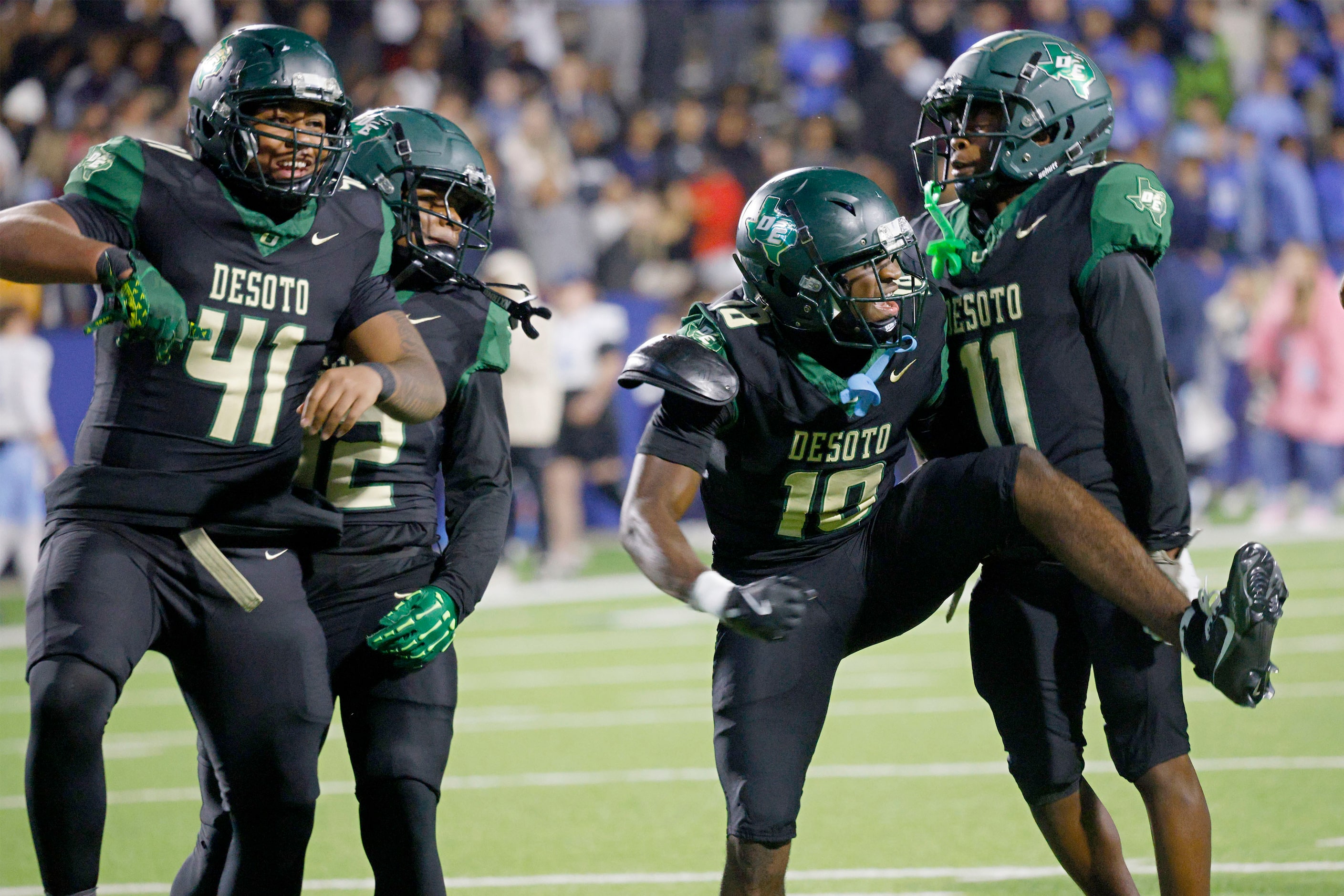 DeSoto's Ryan Pelly (18), second from right, reacts after he intercepts a pass against Wylie...