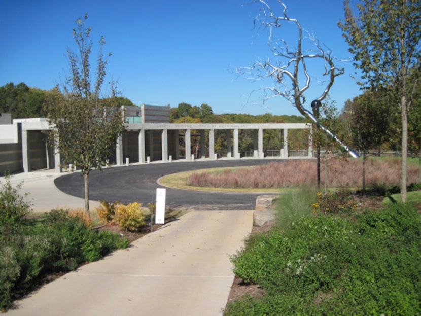 A Roxy Paine sculpture, Yield, is in the circular drive's center. The museum grounds offer...