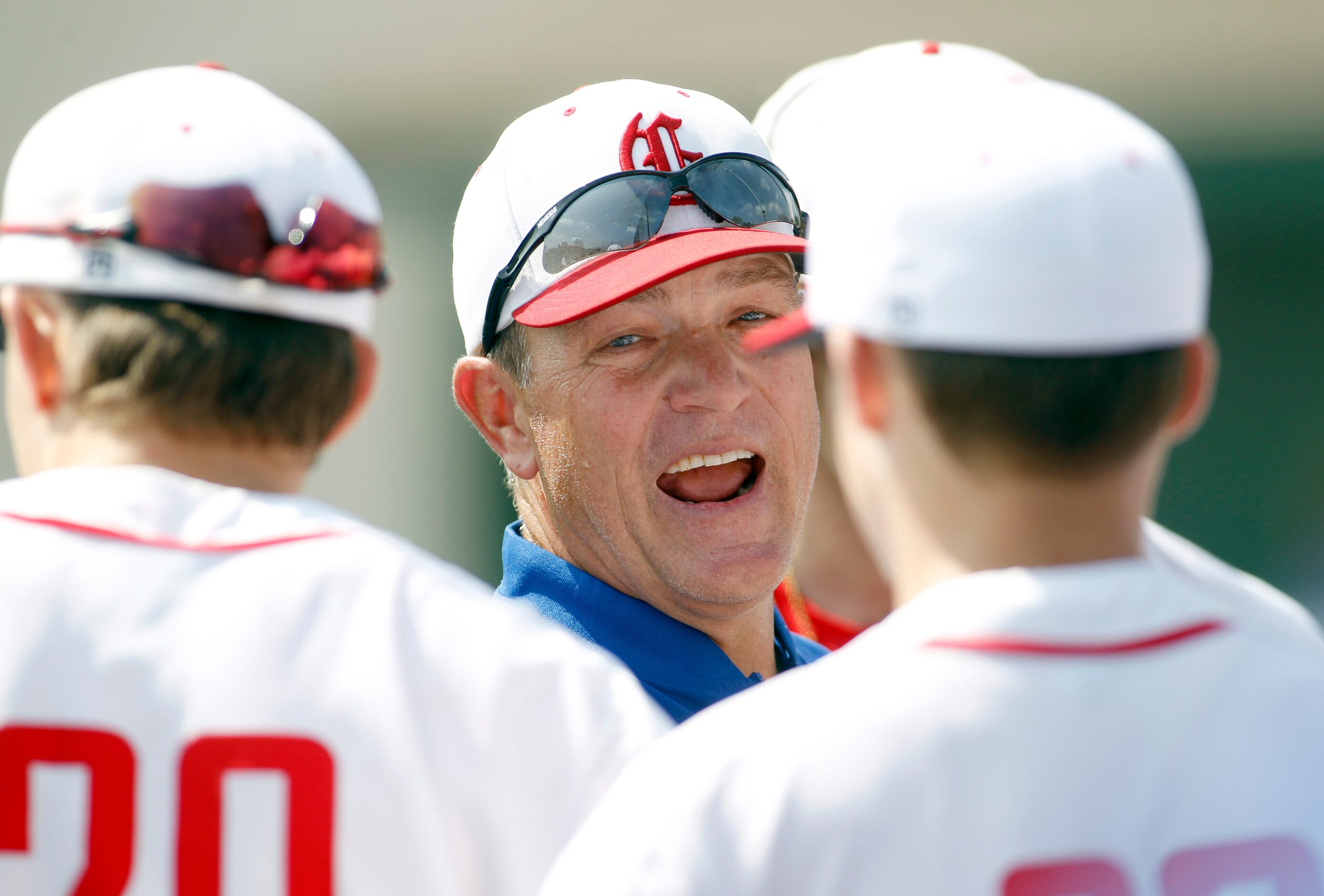 Grapevine head coach Jimmy Webster shares game strategy with his players just prior to the...