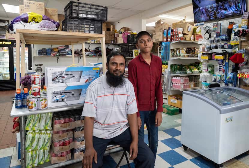 Store owner Mohammad Osman Abduljabbar and his son, Hassan Abduljabbar, inside the Burmese...