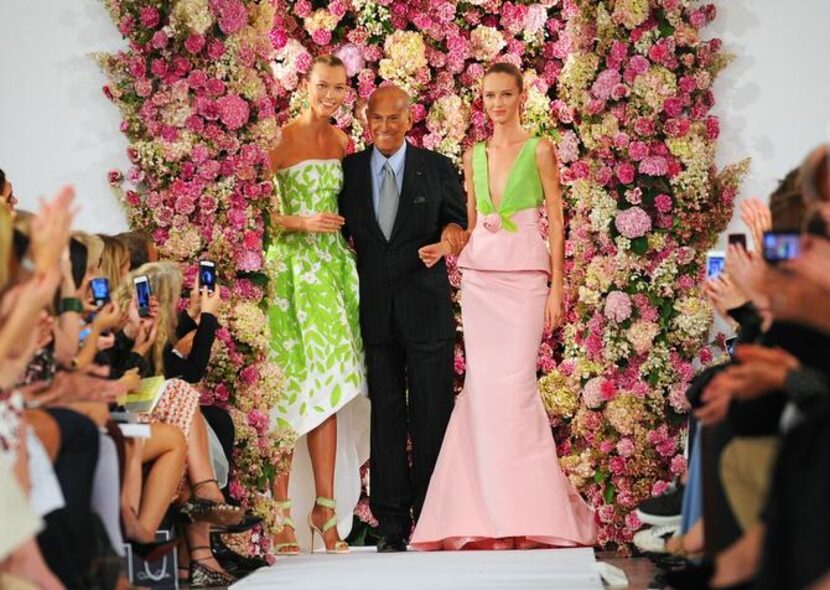 
Last month, de la Renta took a bow with Karlie Kloss (left) and Daria Strokous at Fashion...