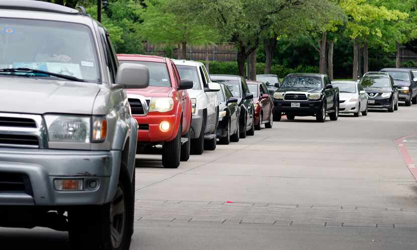 Cars lined up at the food pantry at Lovers Lane United Methodist Church in Dallas on May 7.