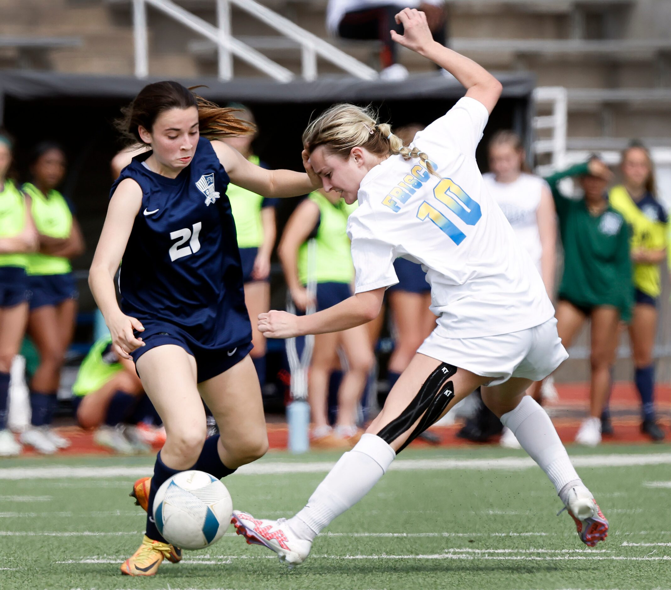 Frisco Reedy Ashlev Rabinowitz (21) pushes Frisco’s Lexi Lee (10) during an overtime period...