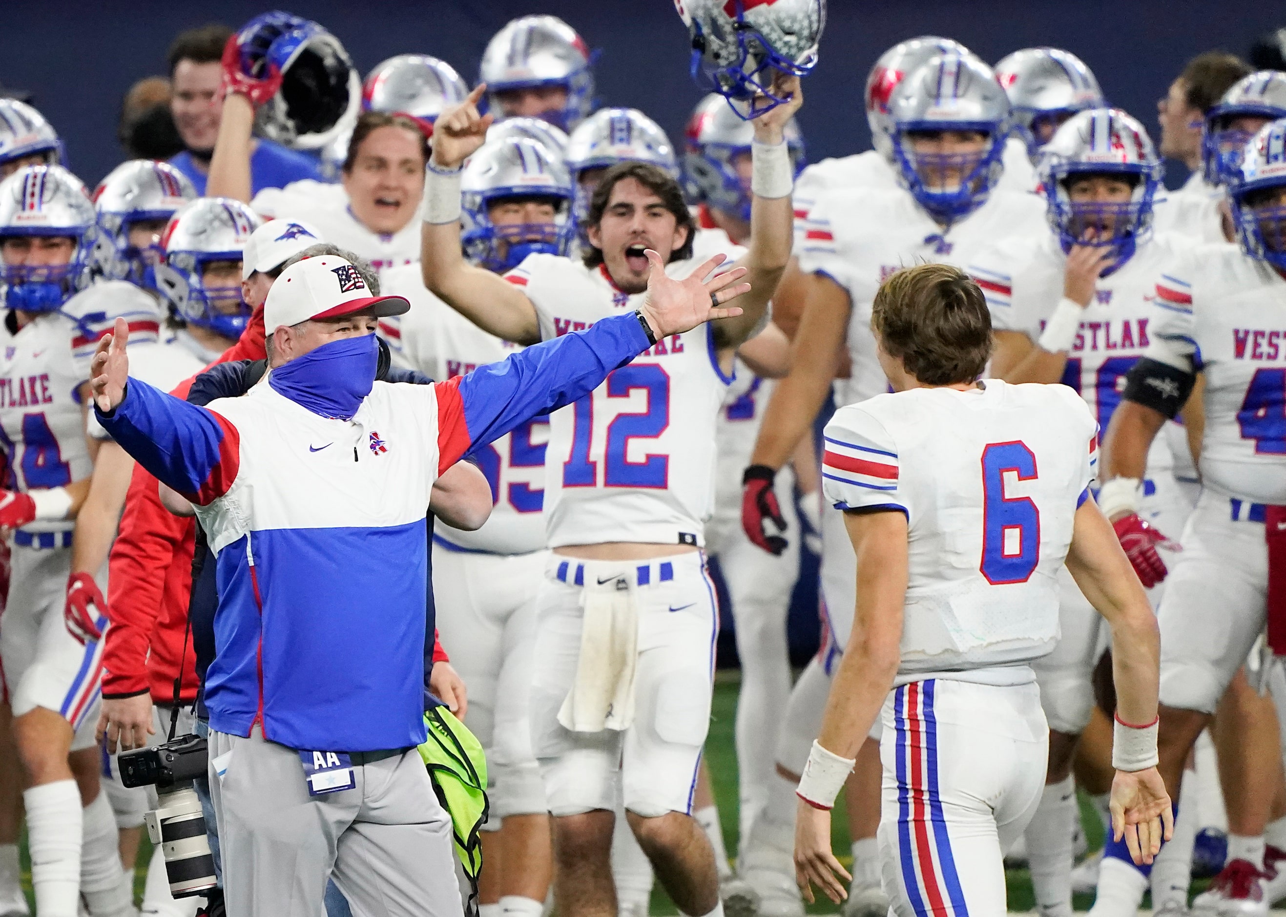 Austin Westlake head coach Todd Dodge hugs quarterback Cade Klubnik (6) as time expires on...