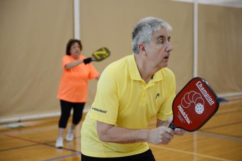 
Michael Dalby and Linda Lightfoot play a round of pickleball at the Cedar Hill Recreation...