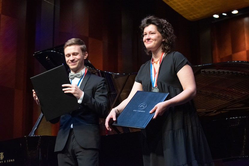 Bronze medal winner Dmytro Choni, 28, of Ukraine and silver medal winner Anna Geniushene,...