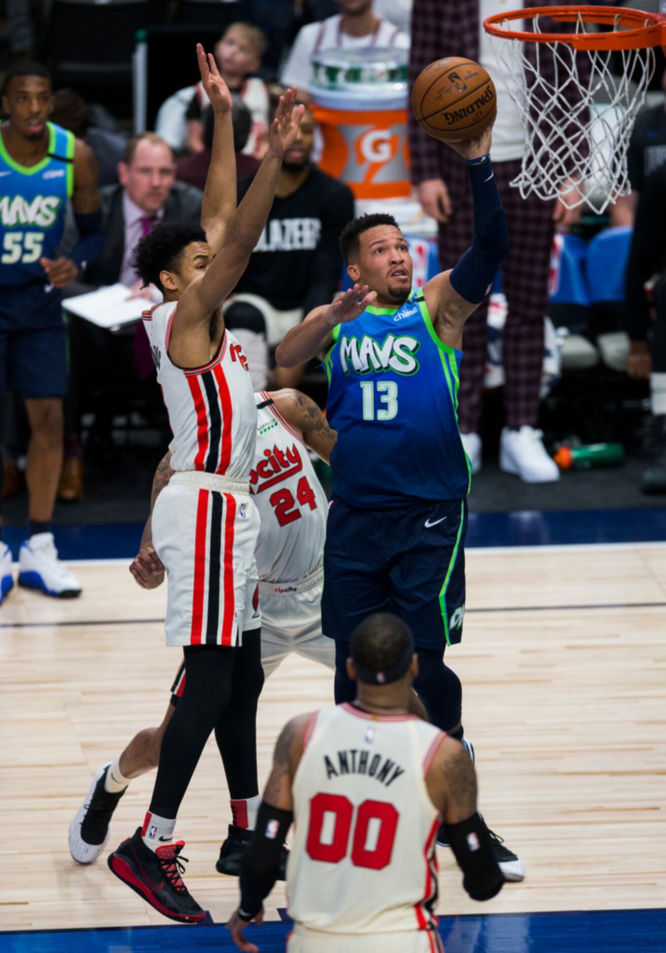 Dallas Mavericks guard Jalen Brunson (13) goes up for a shot during the fourth quarter of an...