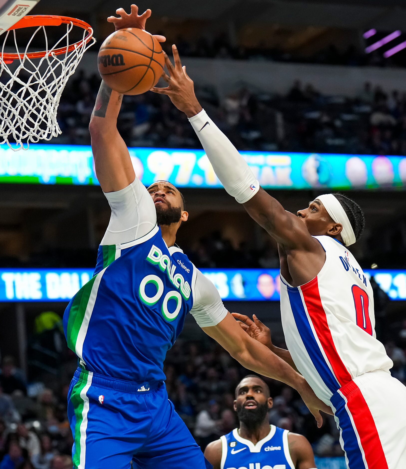 Dallas Mavericks center JaVale McGee (00) grabs a rebound away from Detroit Pistons center...